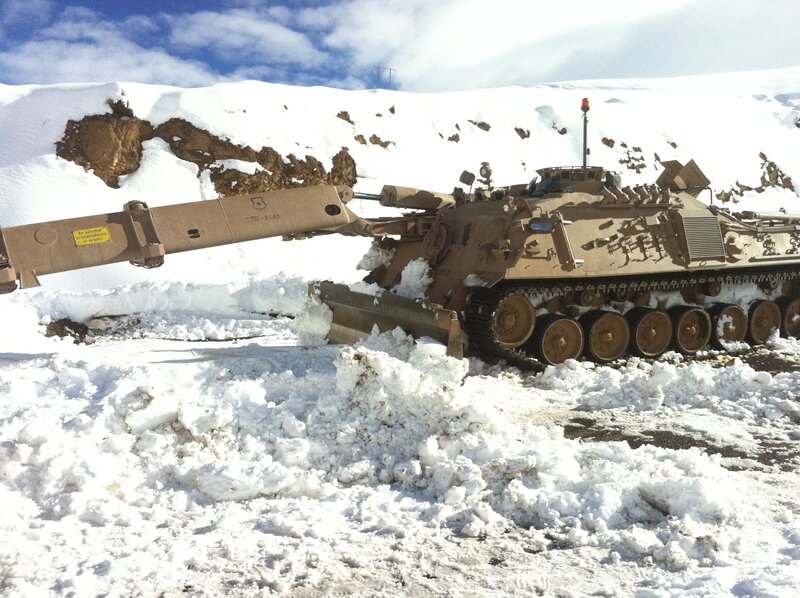 Military vehicle in snowy terrain