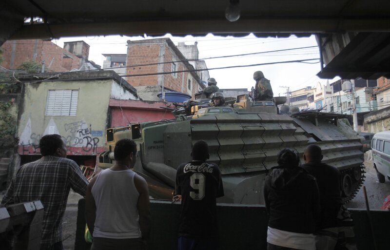 Military vehicle in urban neighborhood