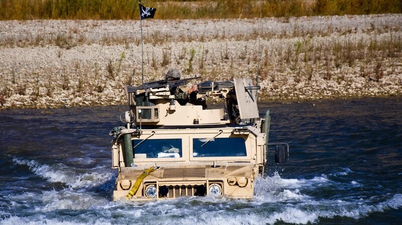 Military Vehicle in Water — Tan