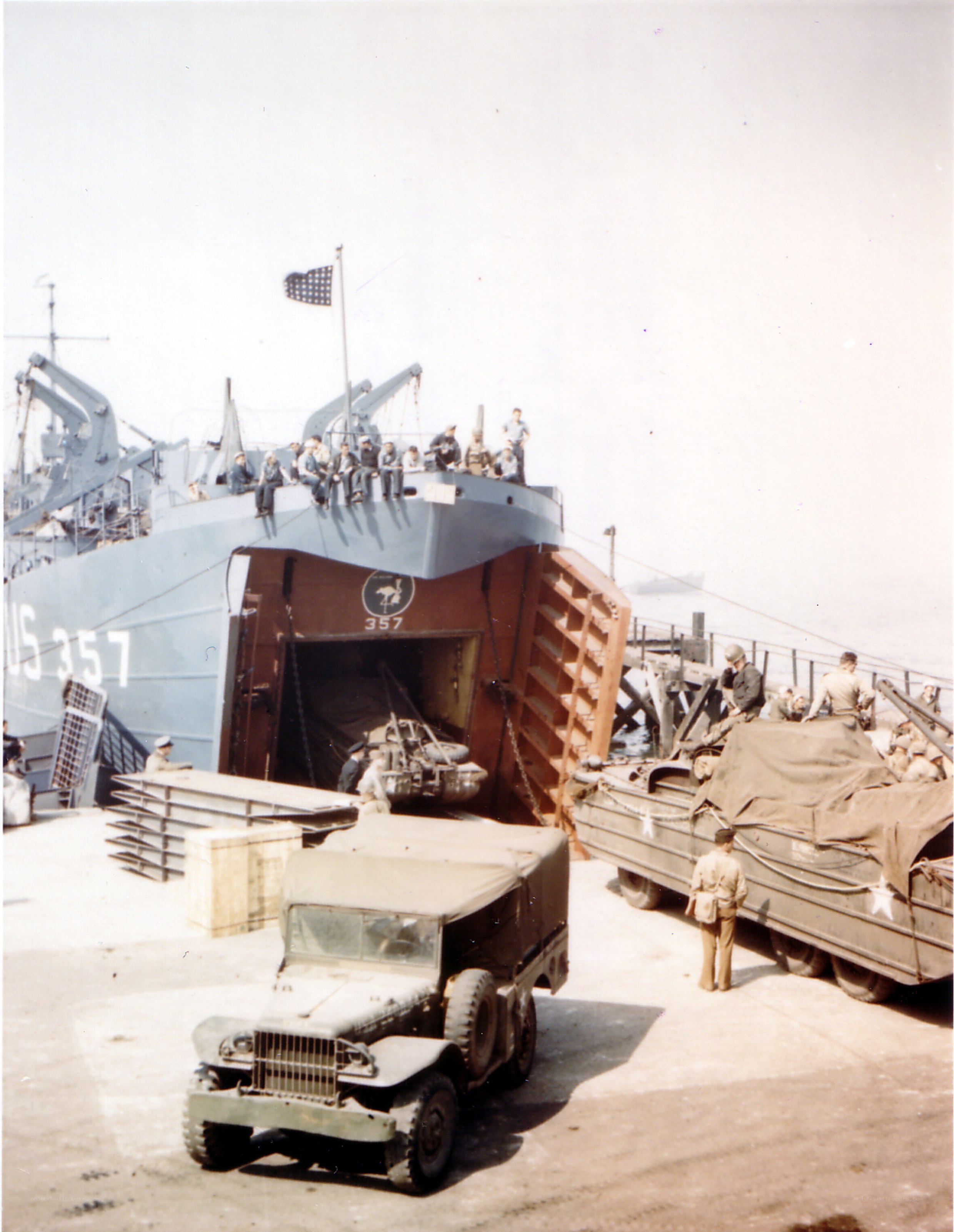 Military vehicle loading at dock