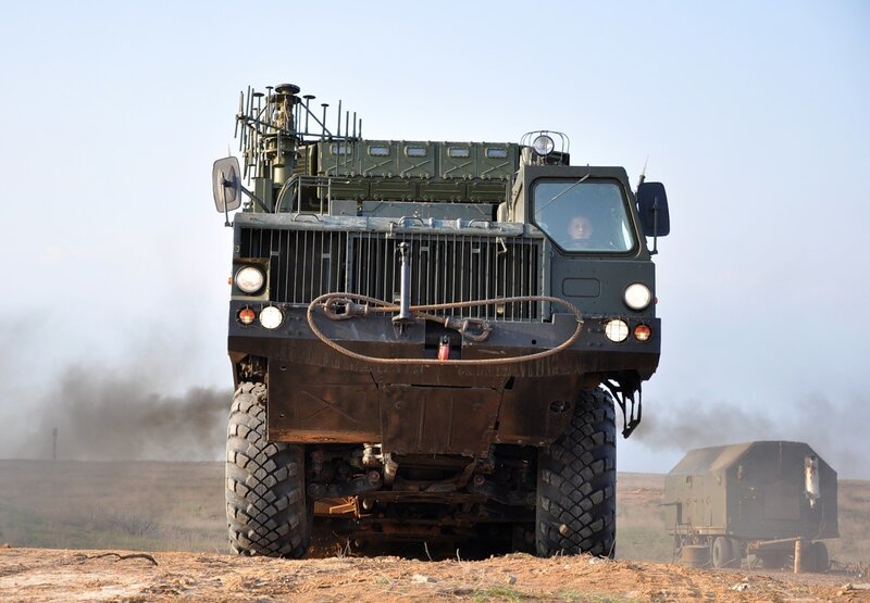 Military vehicle on a dusty field