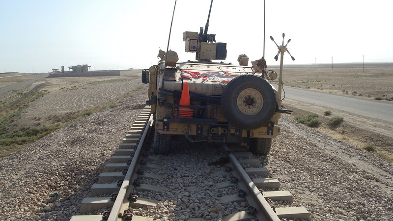 Military vehicle on railway track