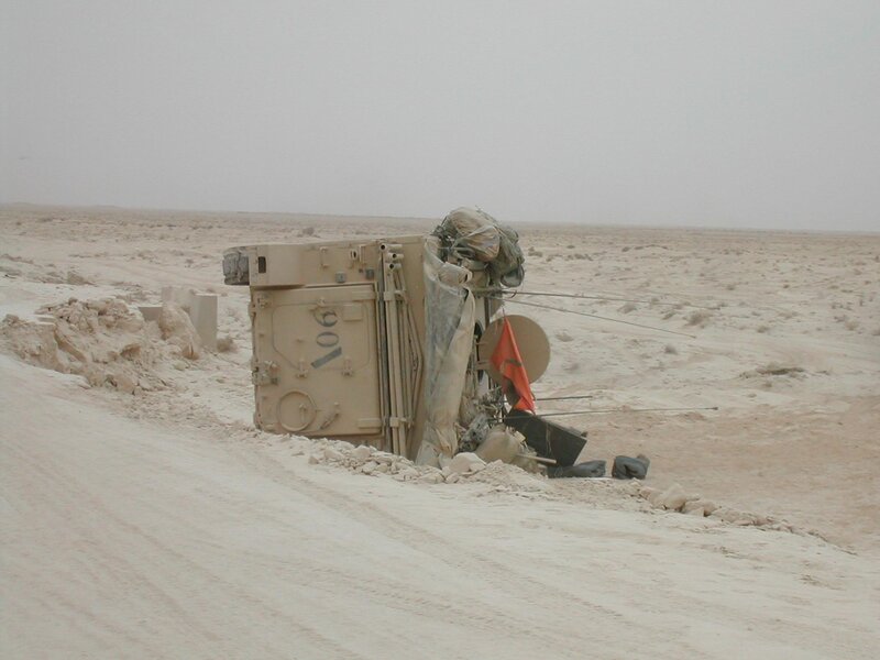 Military vehicle overturned in desert