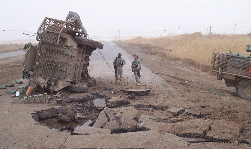 Military vehicle overturned on road