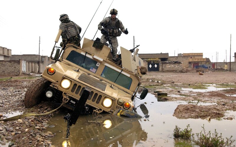 Military vehicle stuck in mud