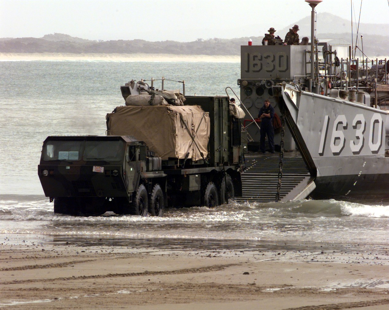 Military vehicle unloading from ship