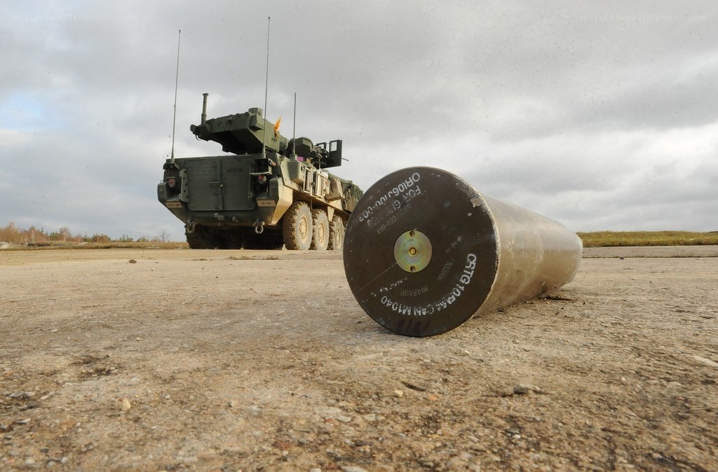 Military vehicle with artillery shell