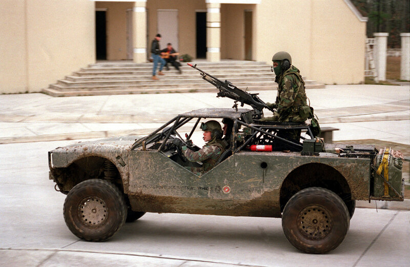 Military vehicle with soldiers
