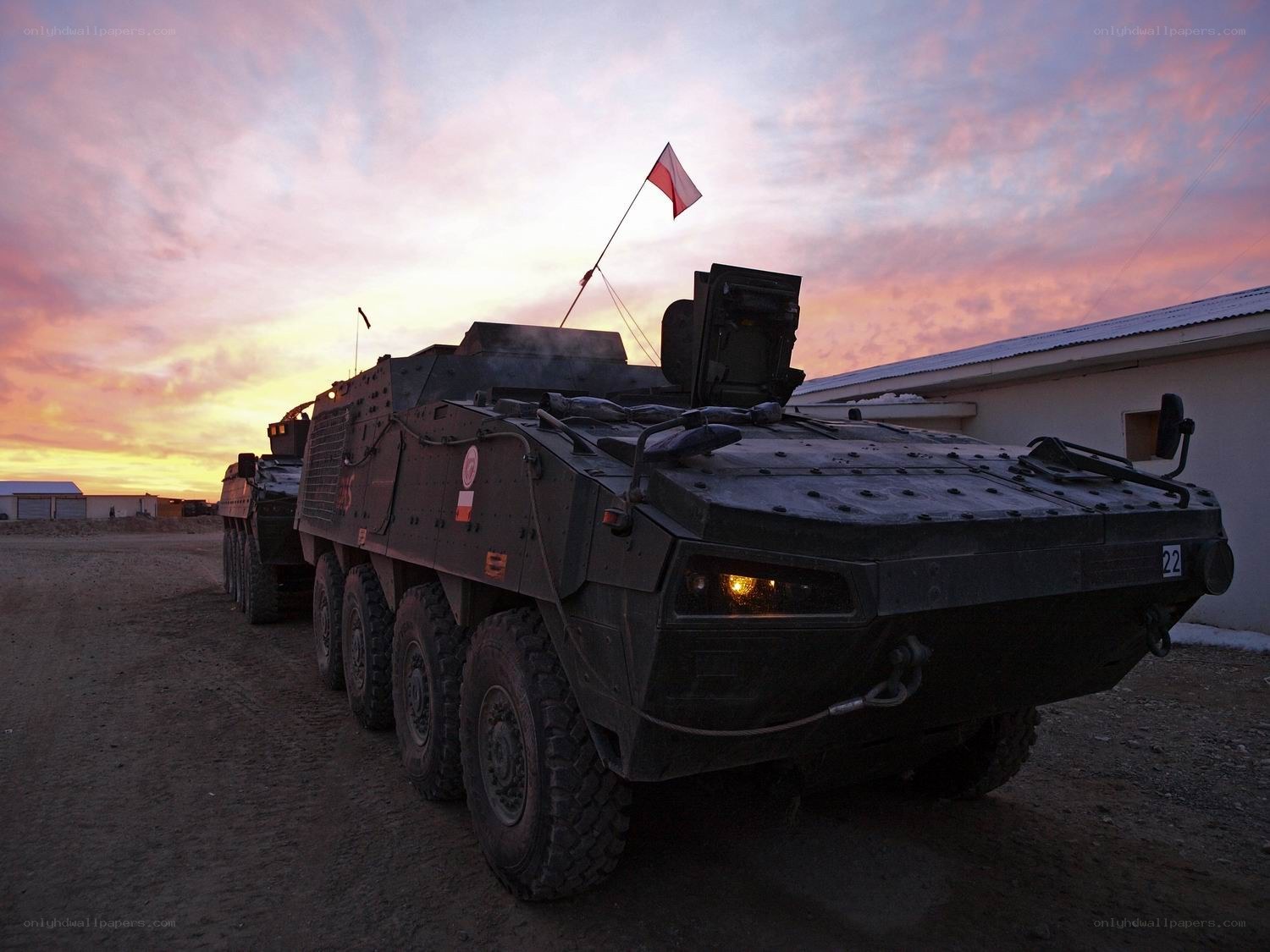 Military vehicles at sunset