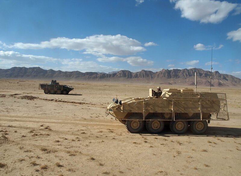 Military Vehicles in Desert — Brown, Arid, Afternoon, Photograph