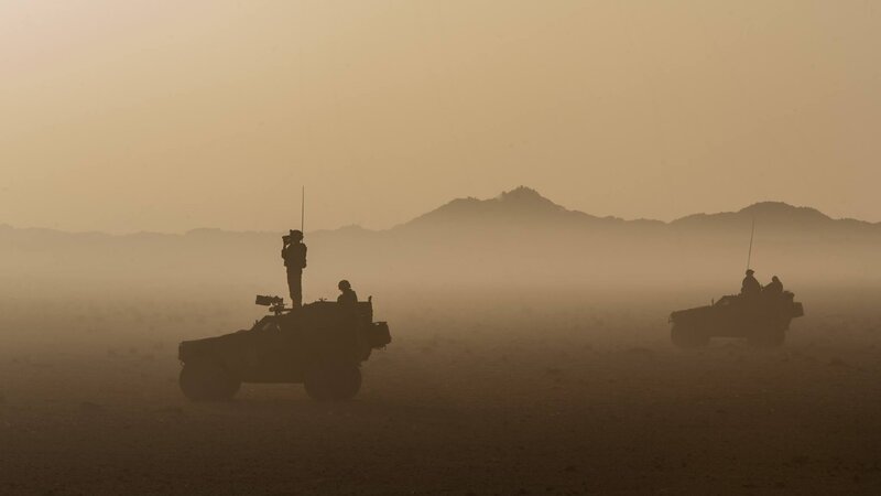 Military Vehicles in Desert — Brown