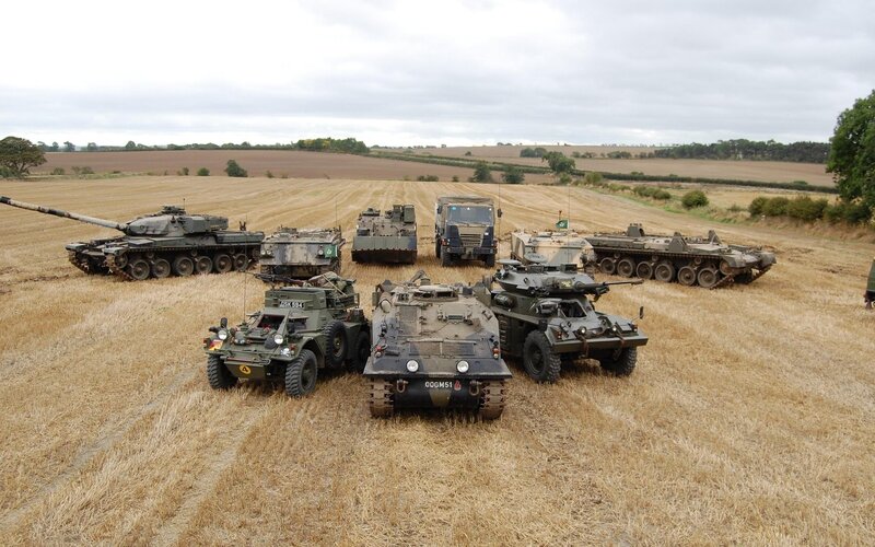 Military Vehicles in Field — Brown