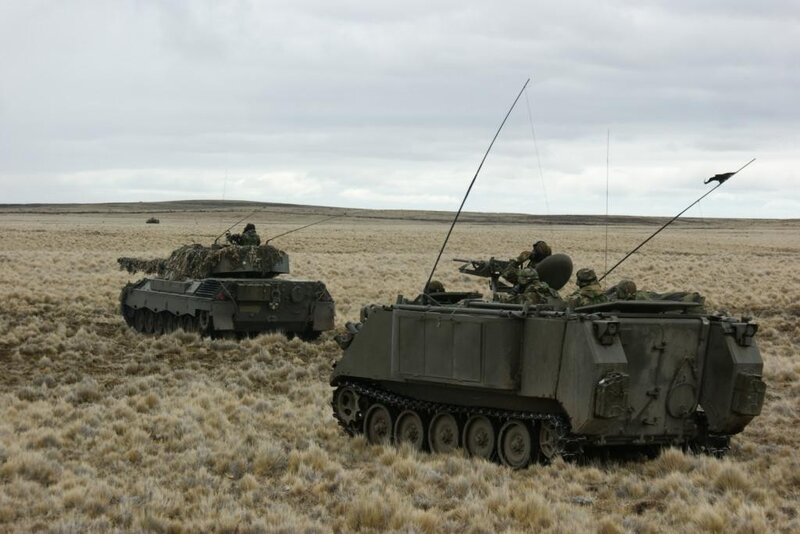 Military vehicles in field exercise