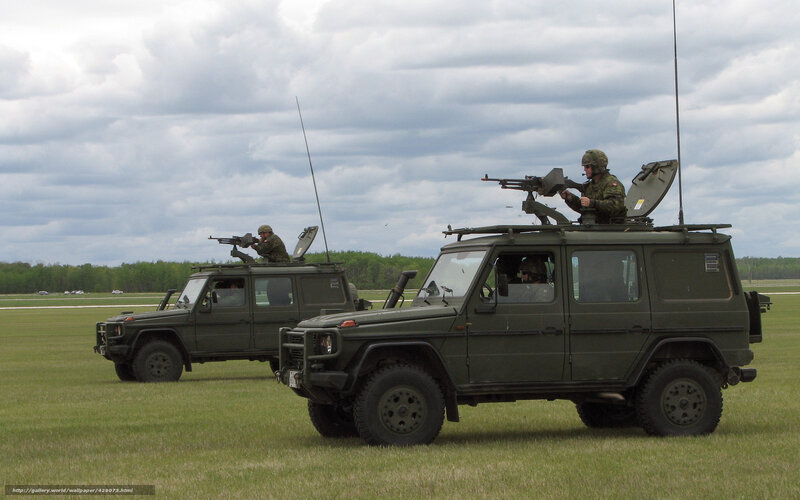 Military vehicles in field exercise