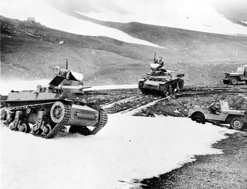 Military vehicles in snowy terrain