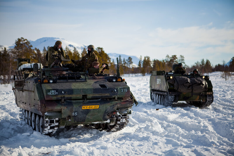 Military vehicles in snowy terrain