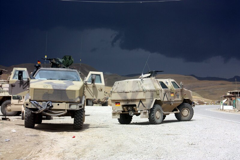 Military vehicles on a desert road