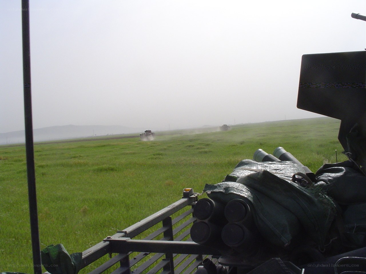 Military vehicles on a field