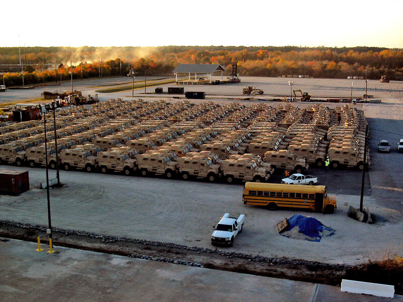 Military vehicles parked in a lot