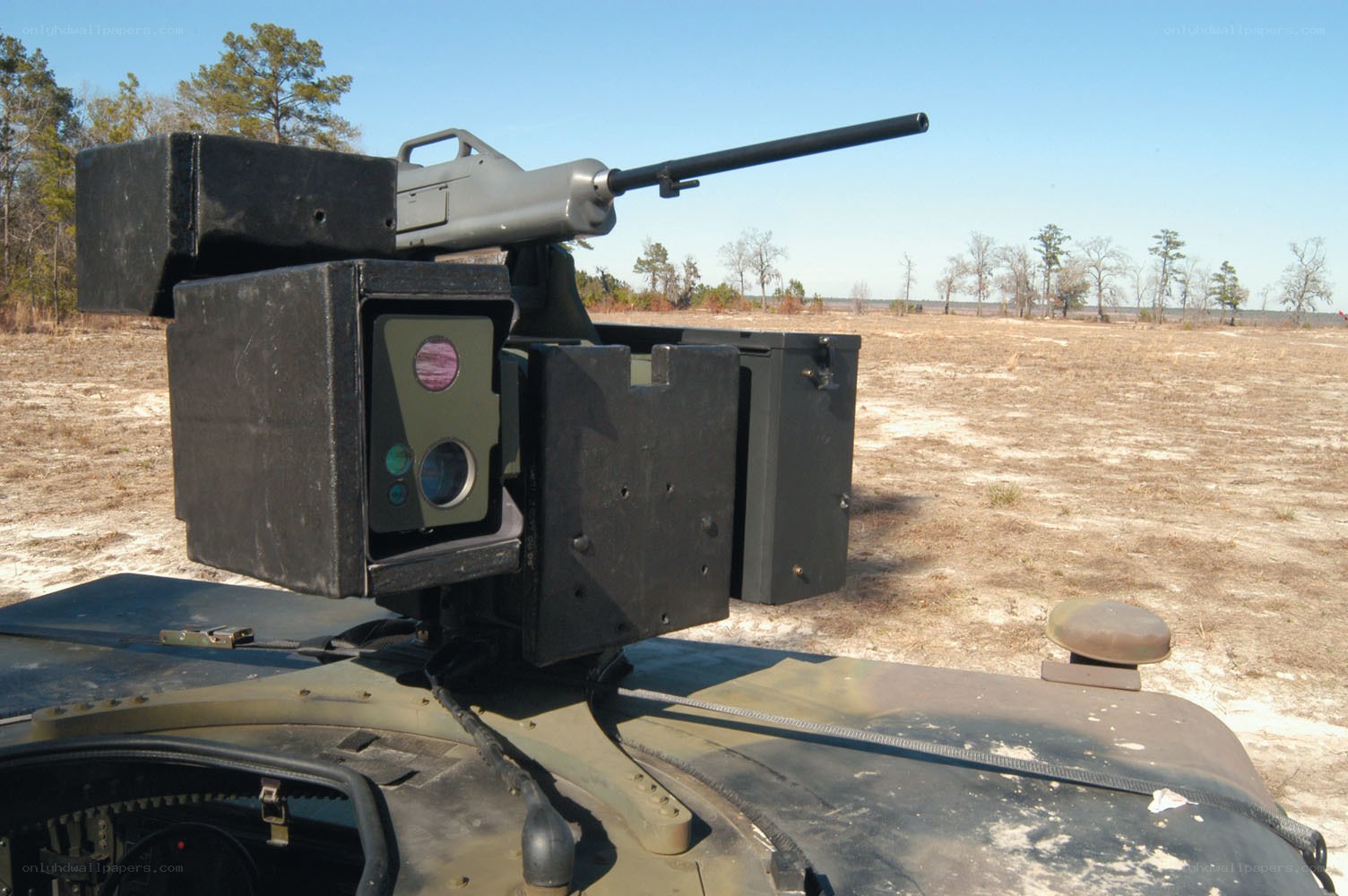 Military weapon system on vehicle