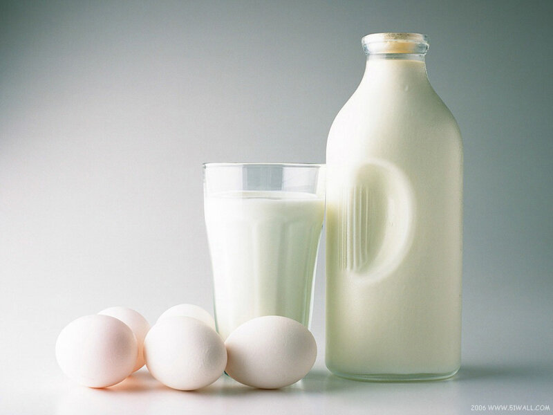 Milk and eggs on white