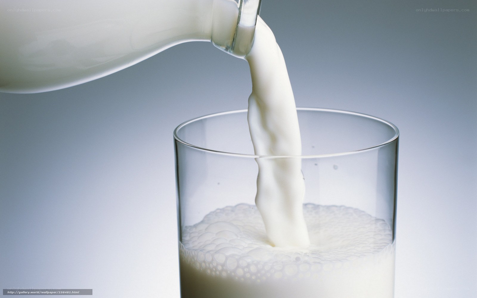 milk being poured into a glass