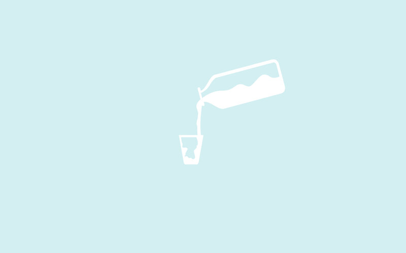 milk being poured into a glass