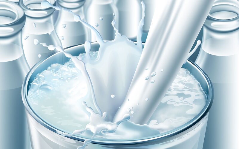 milk being poured into a glass