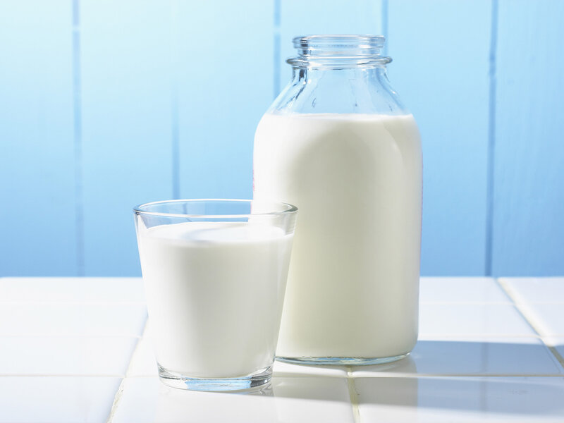 milk in glass bottle and cup