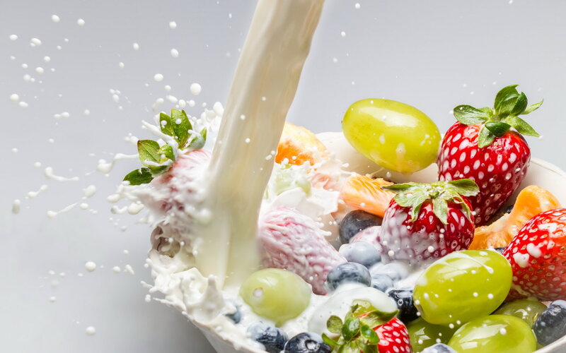 Milk Pouring into Fruit Bowl
