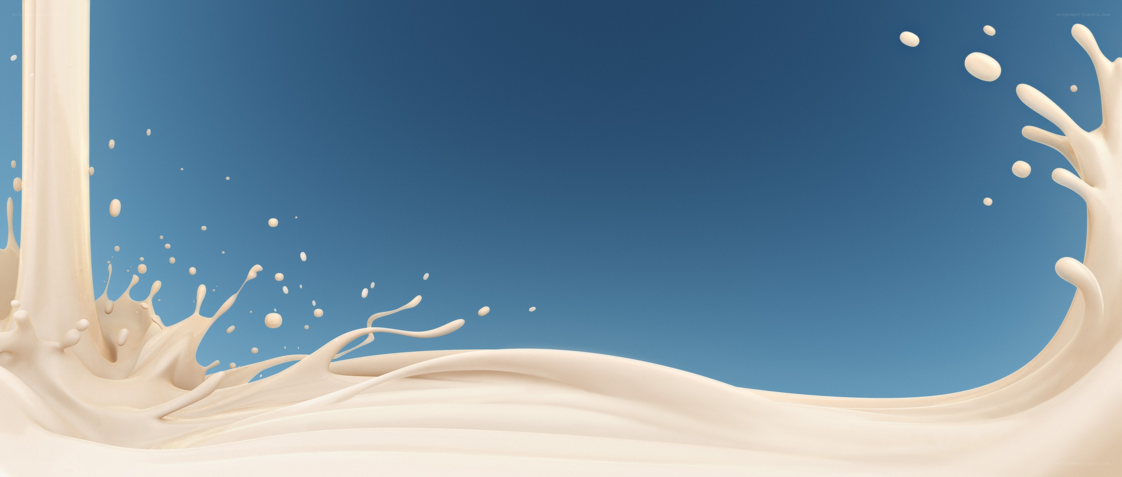 milk splash on blue