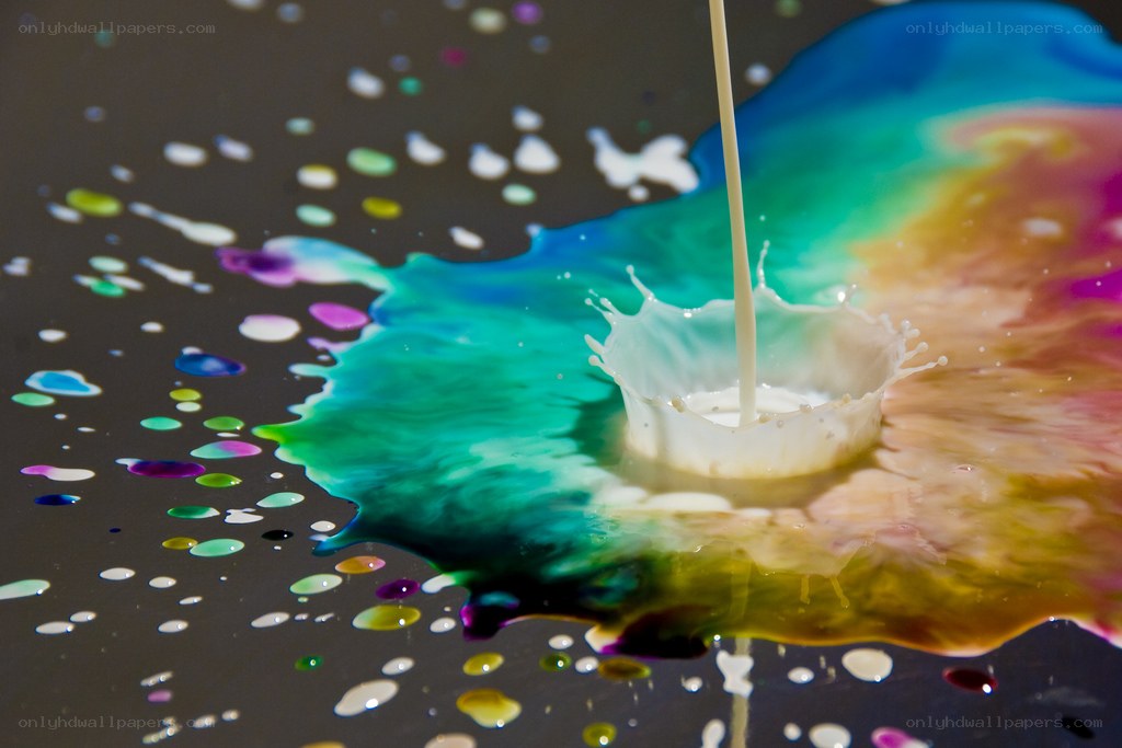 milk splash on colorful surface