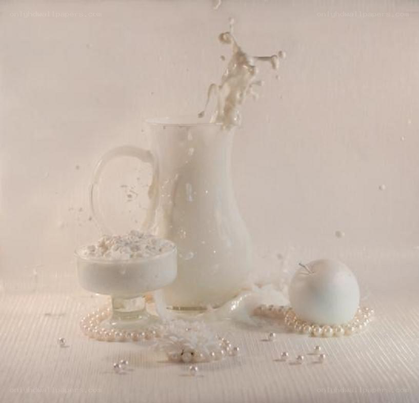 milk splashing in a pitcher