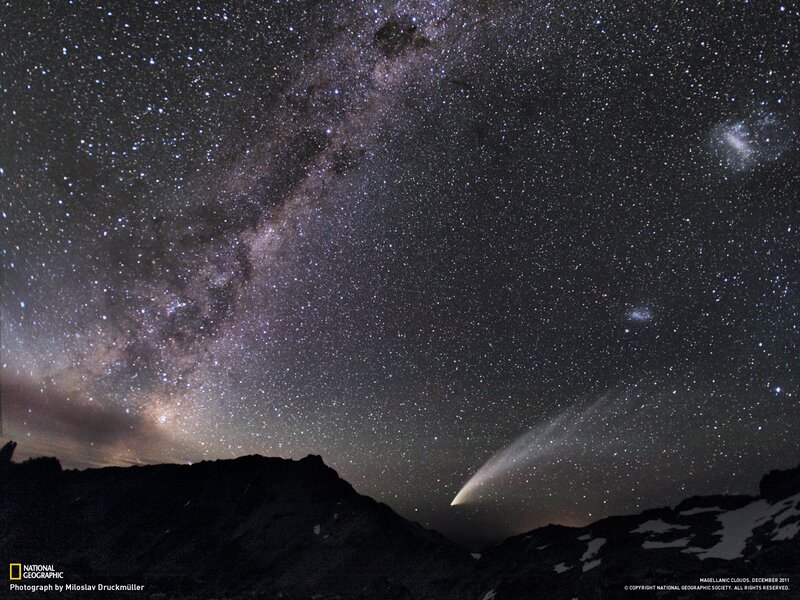 Milky Way and comet over mountains