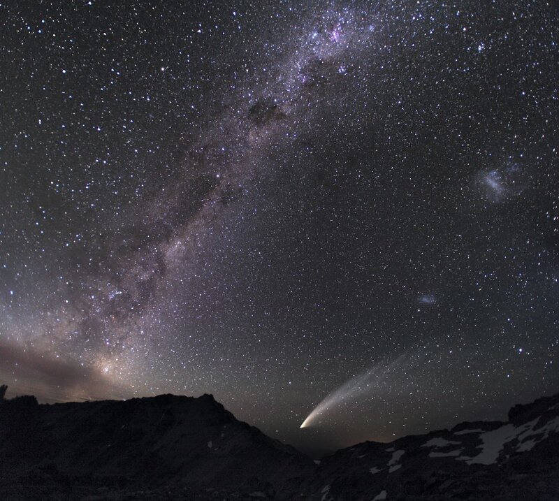 Milky Way and comet over mountains