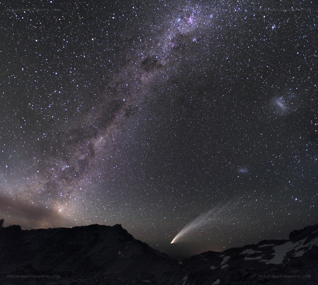 Milky Way and comet over mountains