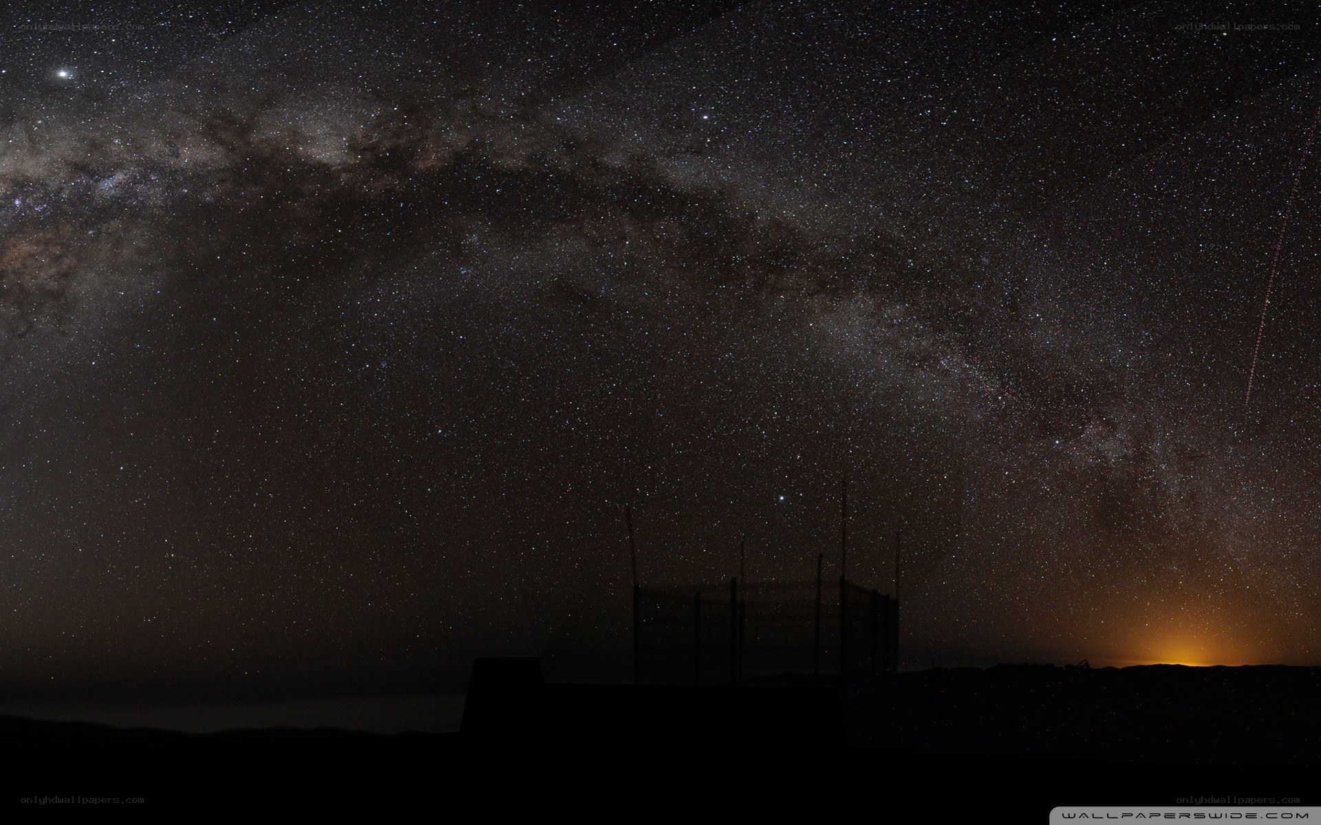 Milky Way over a silhouetted structure