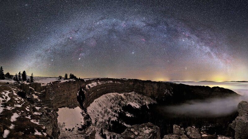 Milky Way over a snowy canyon