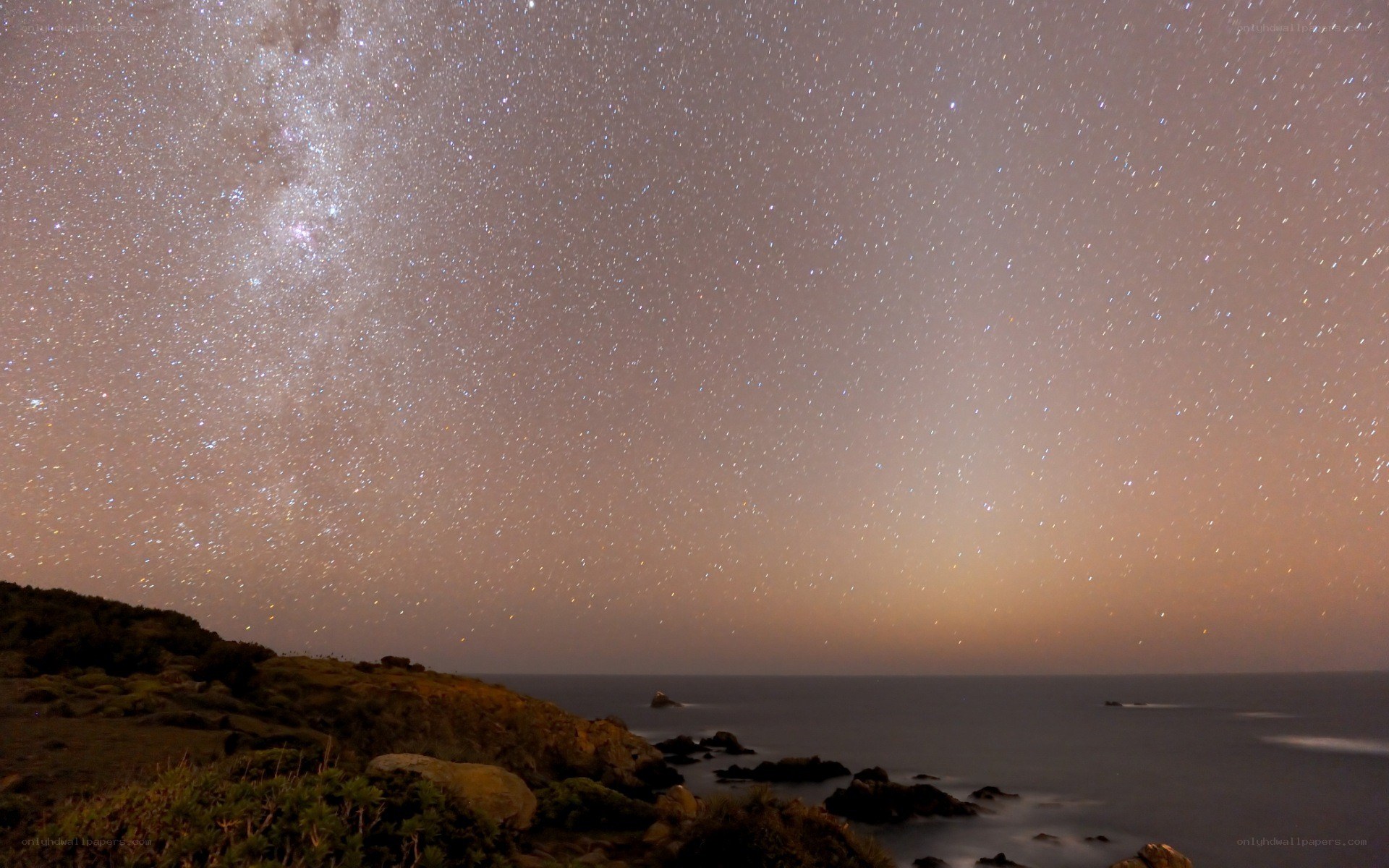 Milky Way over coastal cliffs