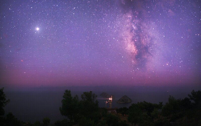 Milky Way over coastal lighthouse