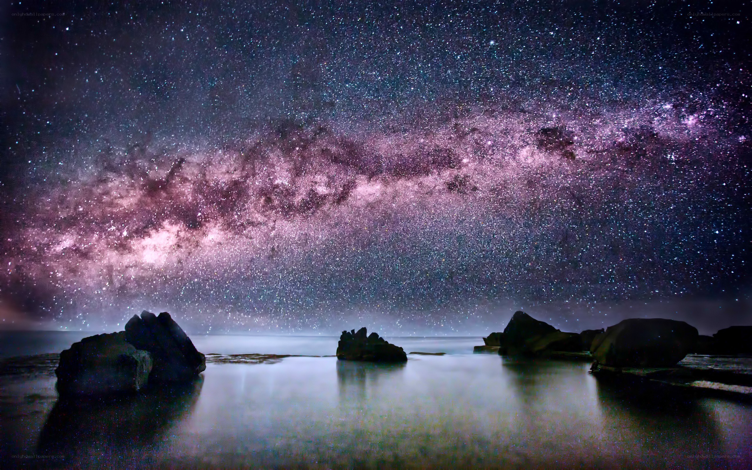 Milky Way over coastal rocks