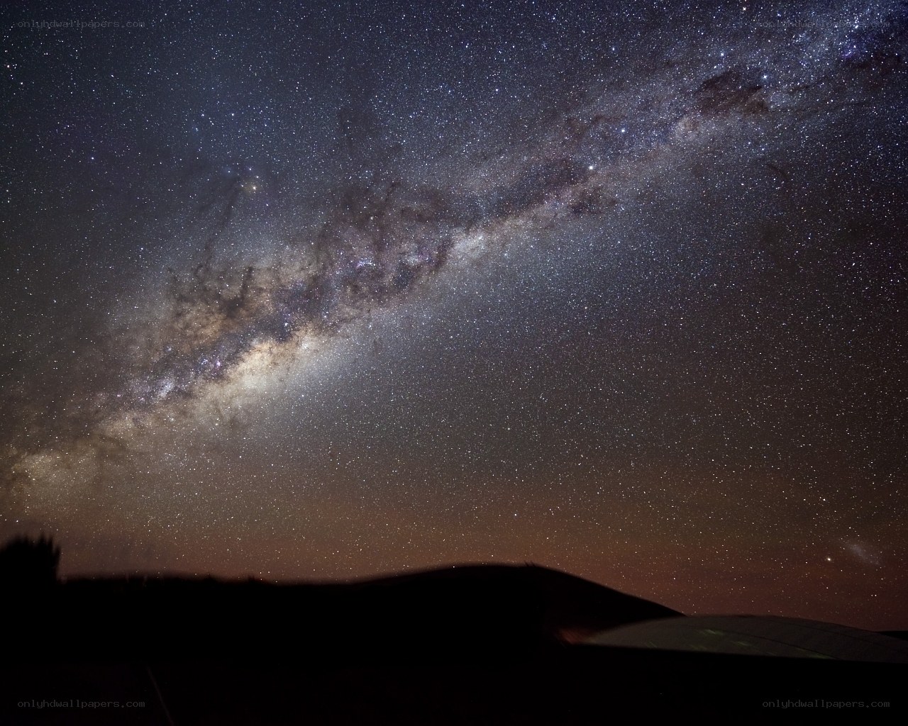 Milky Way over dark hills