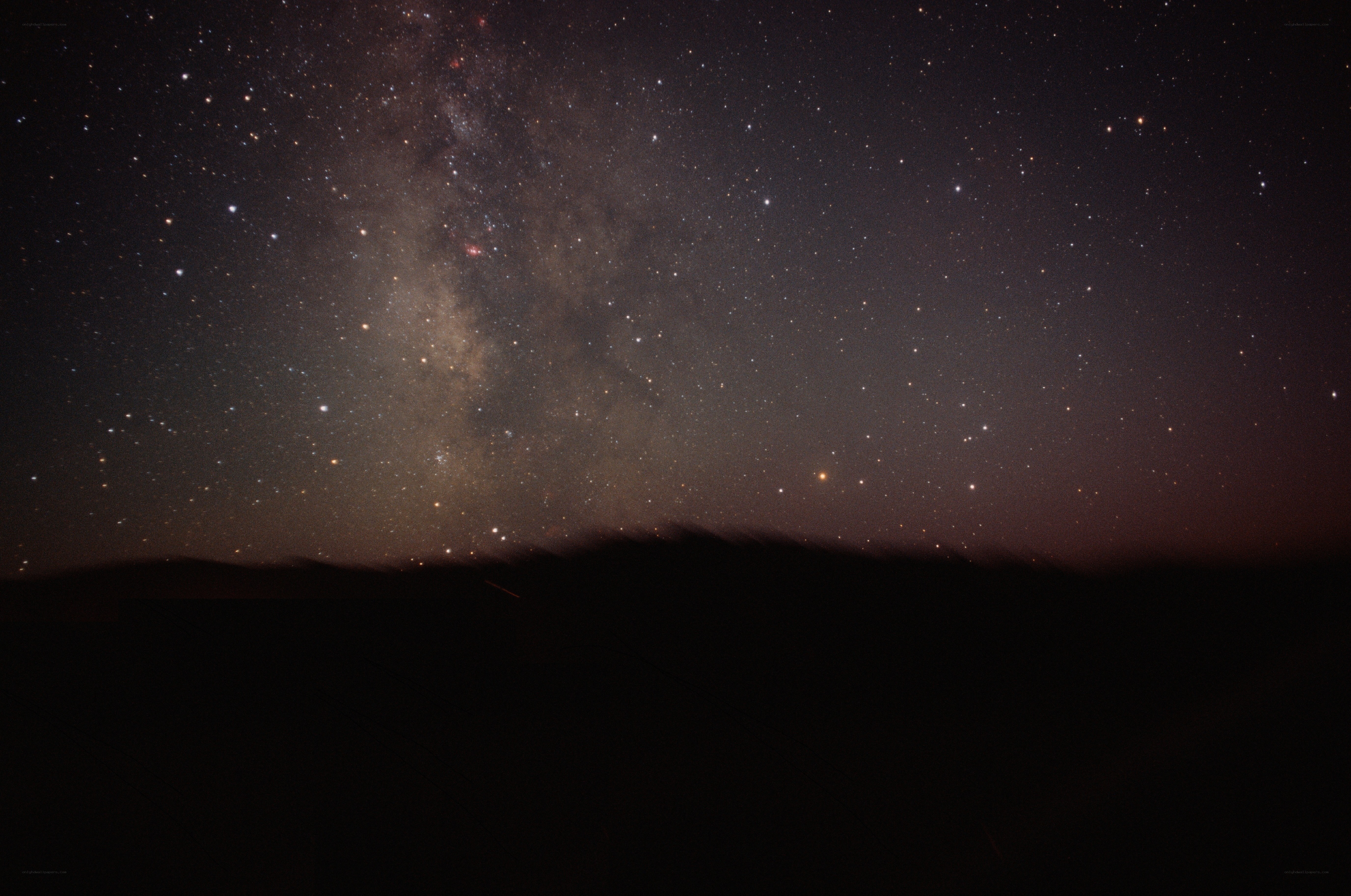 Milky Way over dark landscape
