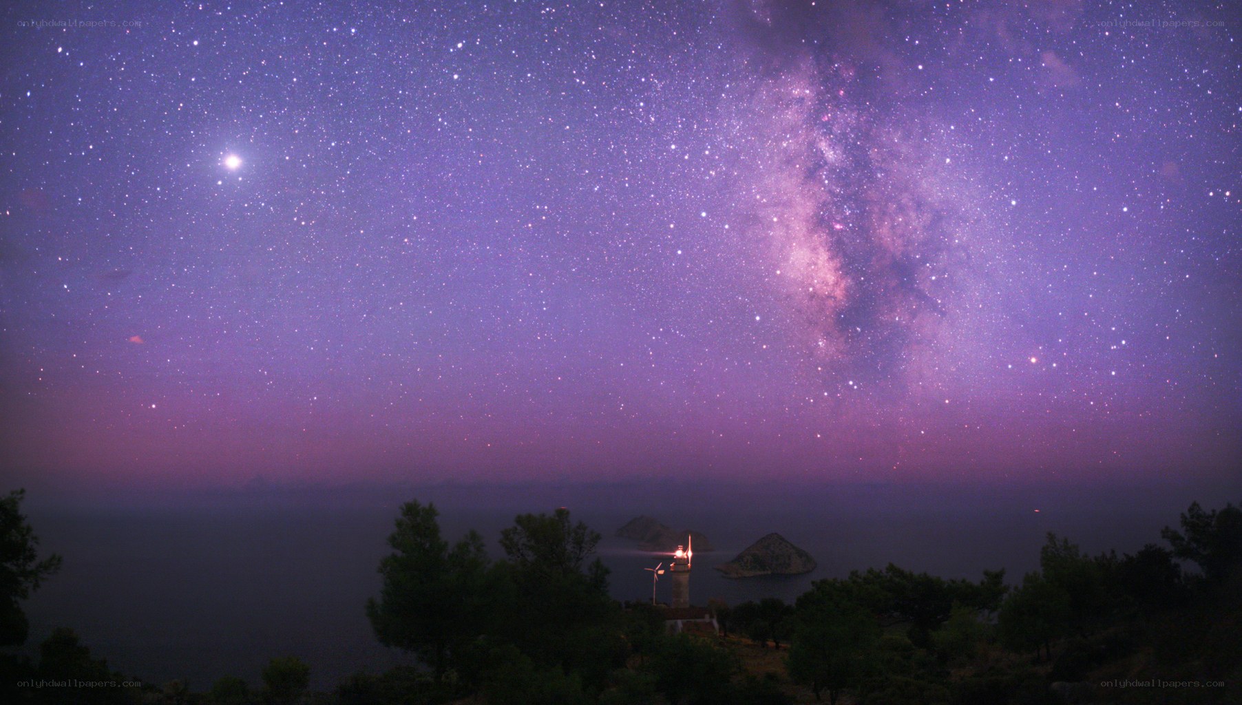 Milky Way over lighthouse