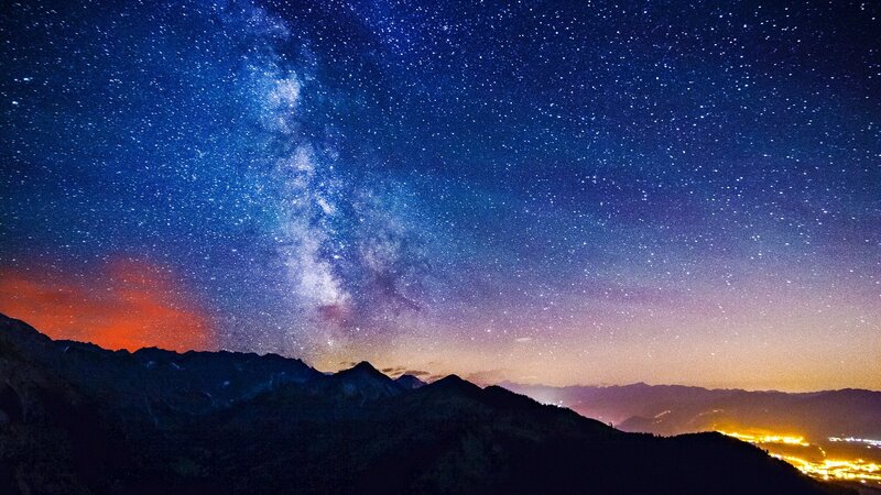 Milky Way over Mountains — City Lights