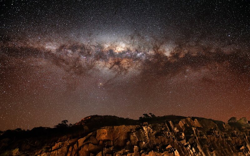 Milky Way over rocky cliffs