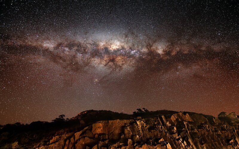 Milky Way over rocky cliffs