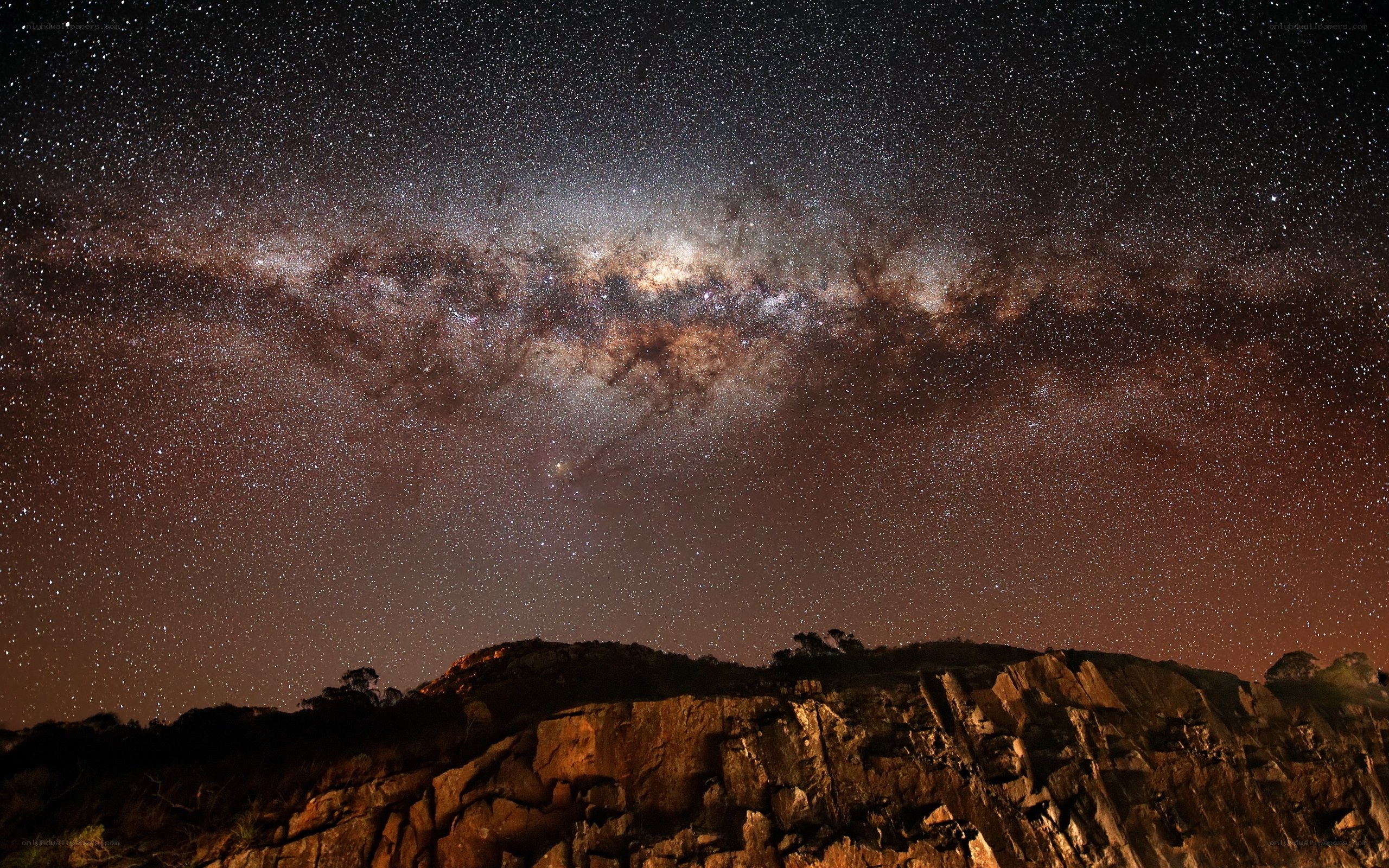 Milky Way over rocky cliffs