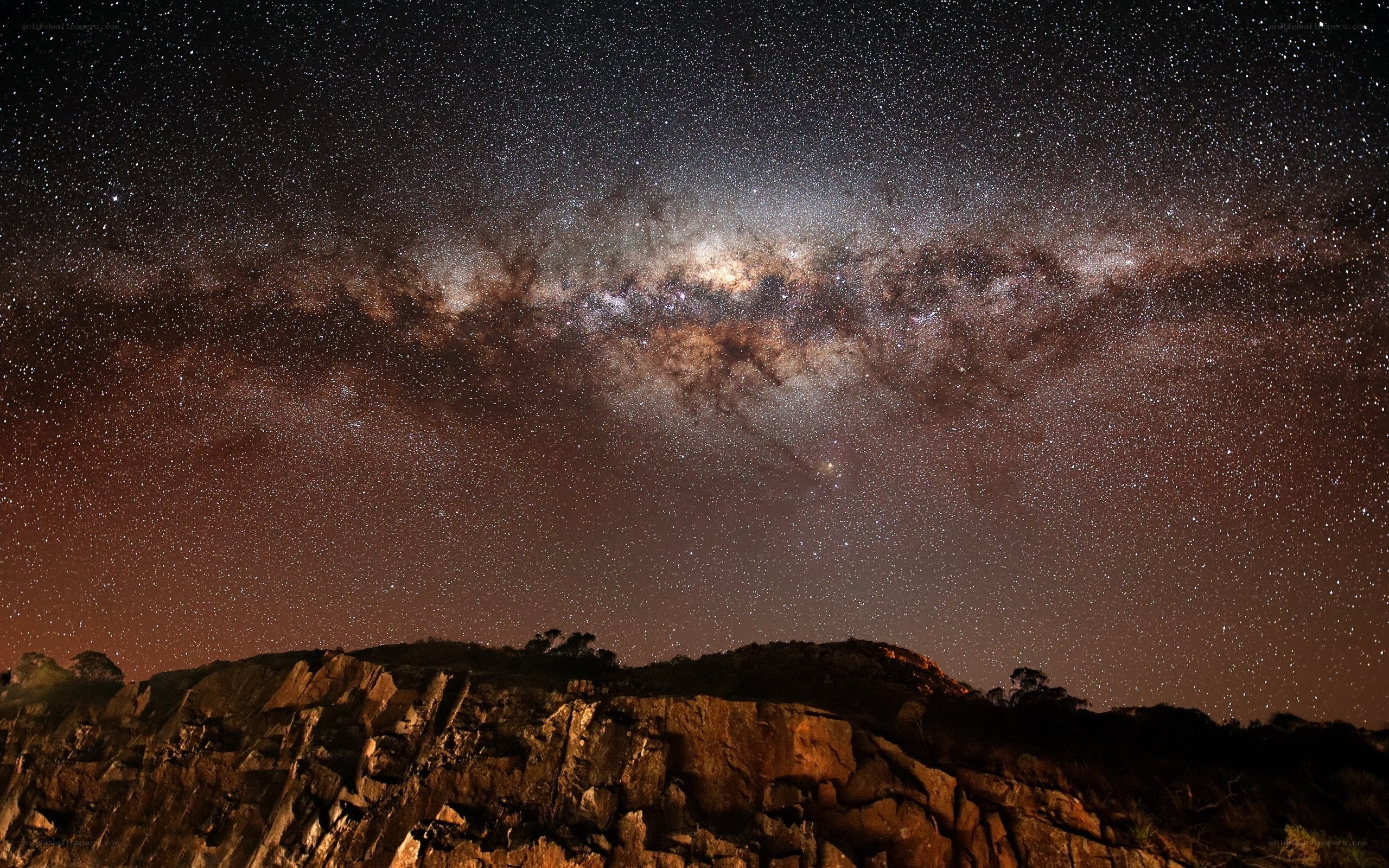 Milky Way over rocky landscape