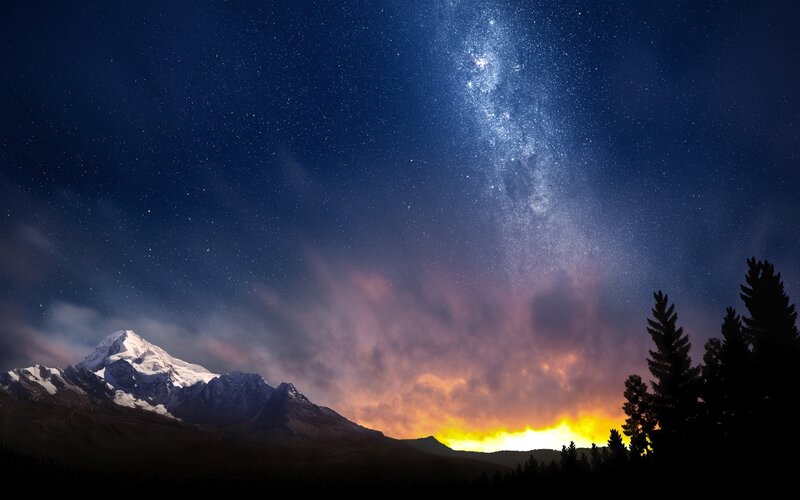 Milky Way over snow-capped mountain